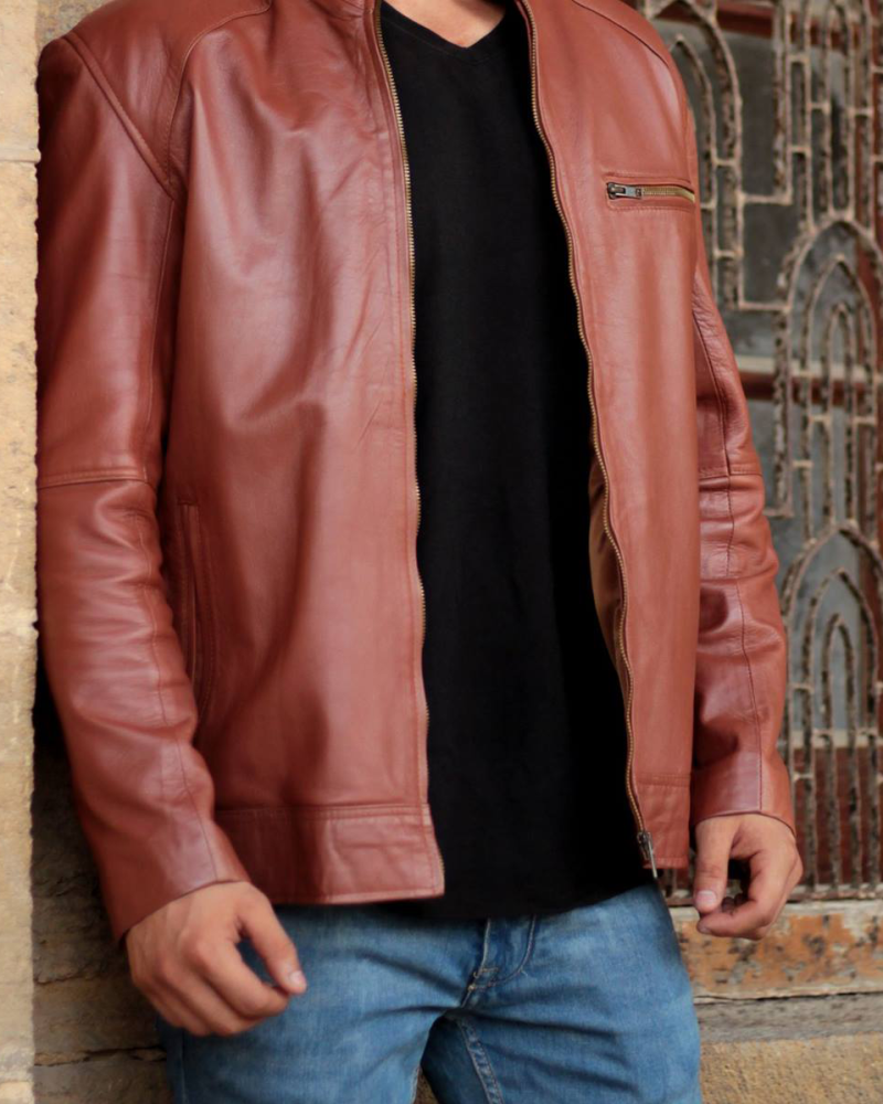 Man wearing a stylish genuine sheepskin jacket, perfect for winter warmth and rugged fashion.
