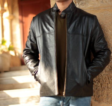 Man wearing a stylish genuine sheepskin jacket, perfect for winter warmth and rugged fashion.