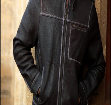 Black leather biker jacket with white contrast stitching and asymmetrical zipper