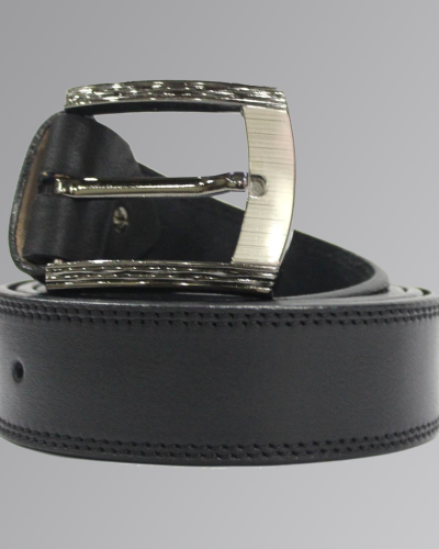 Brown leather casual belt with silver buckle on plain background