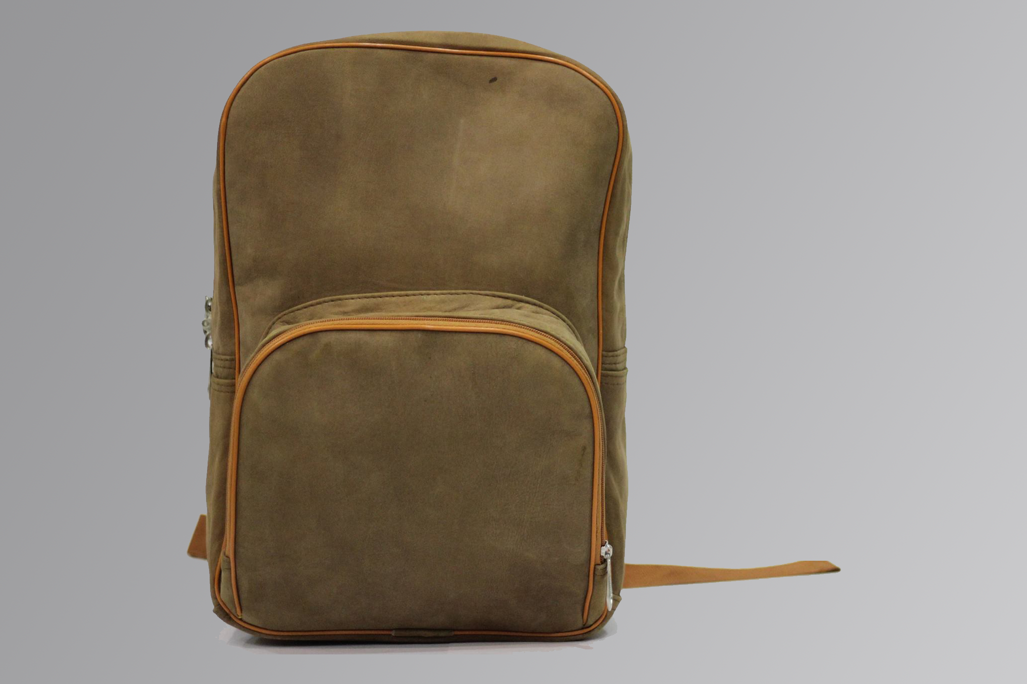 Brown leather backpack with front pockets and adjustable straps on neutral background