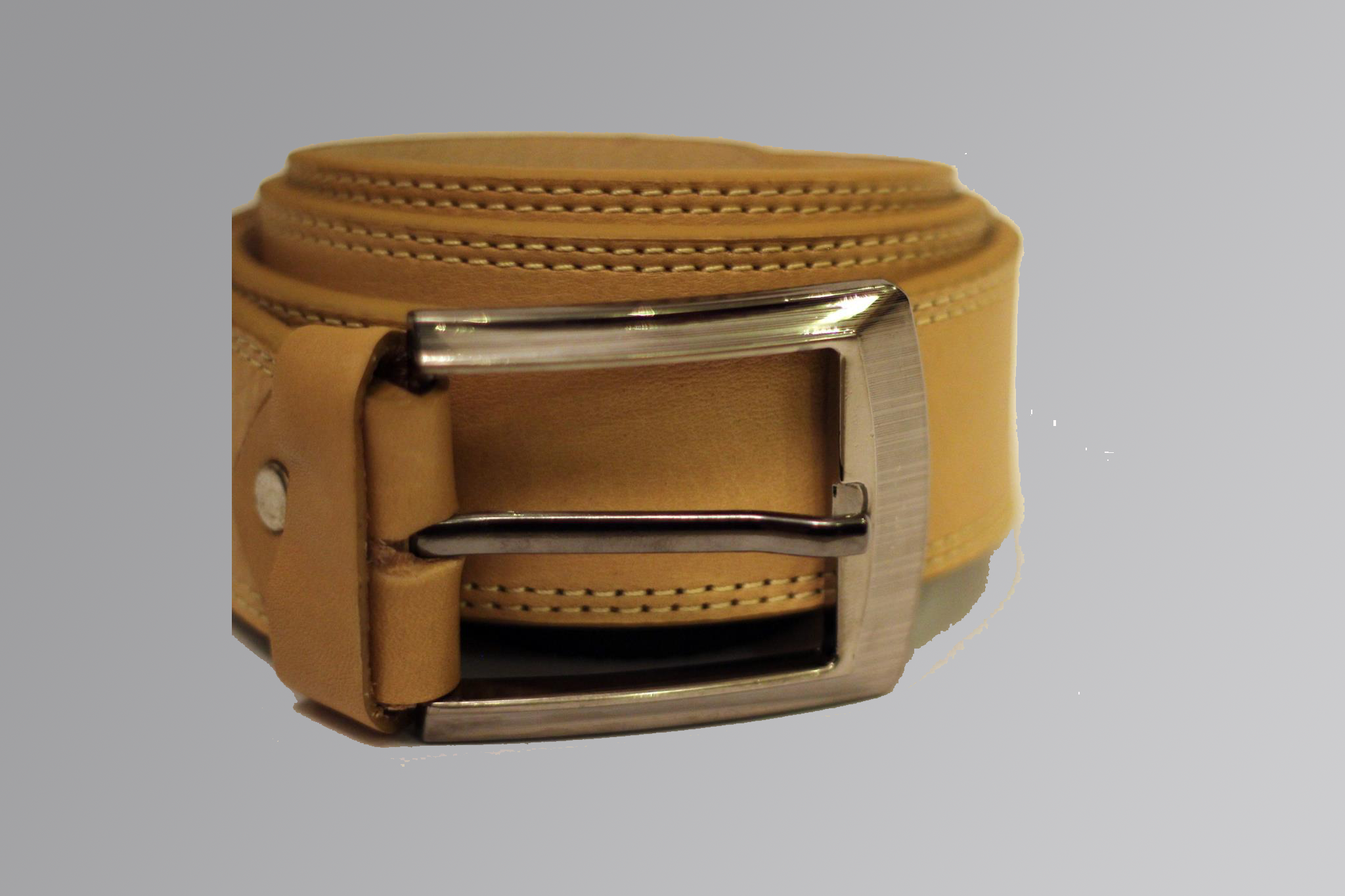 Textured cow nuck leather belt with metal buckle on neutral background