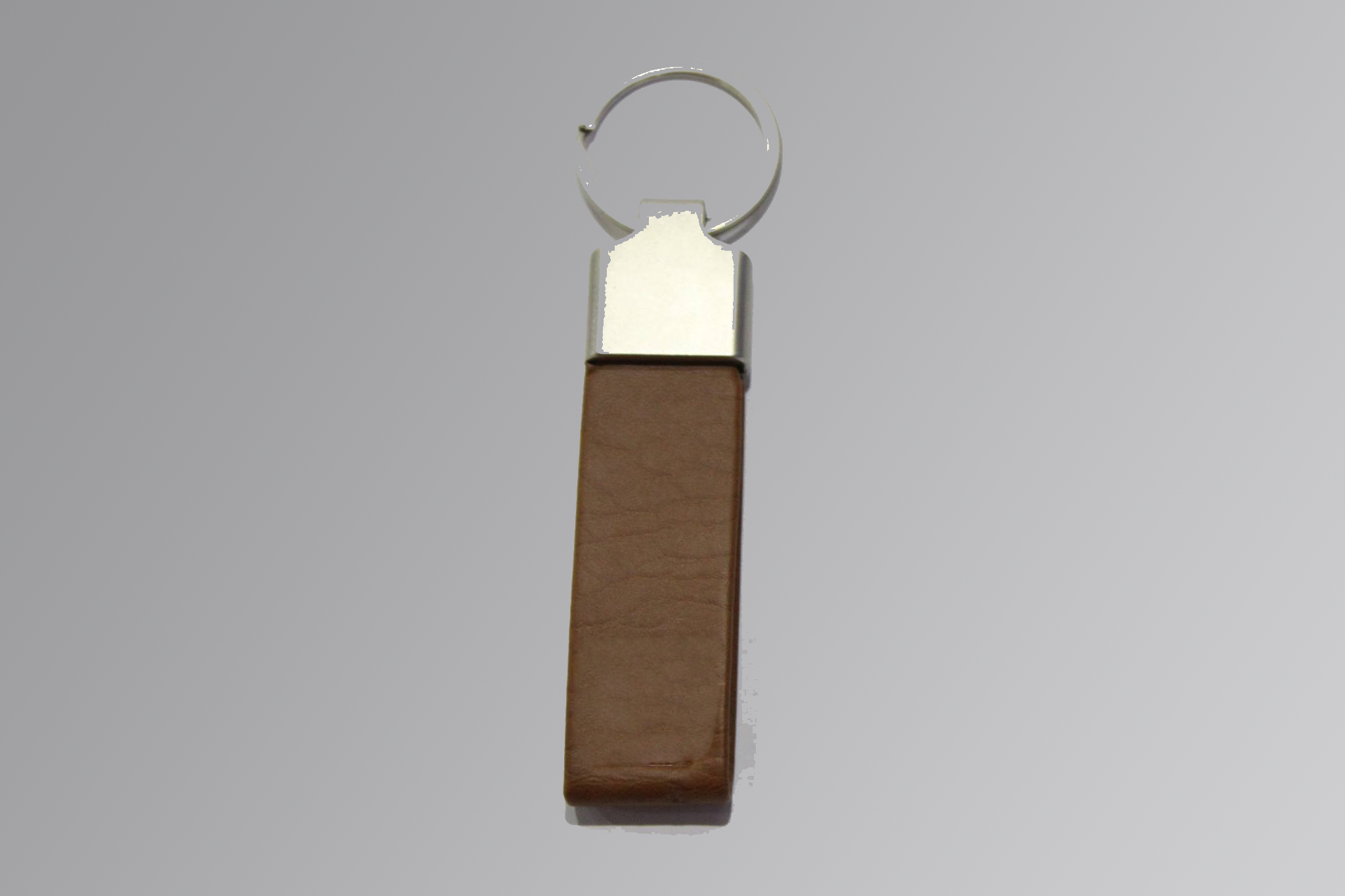 Slim leather keychain with metal ring on a clean background