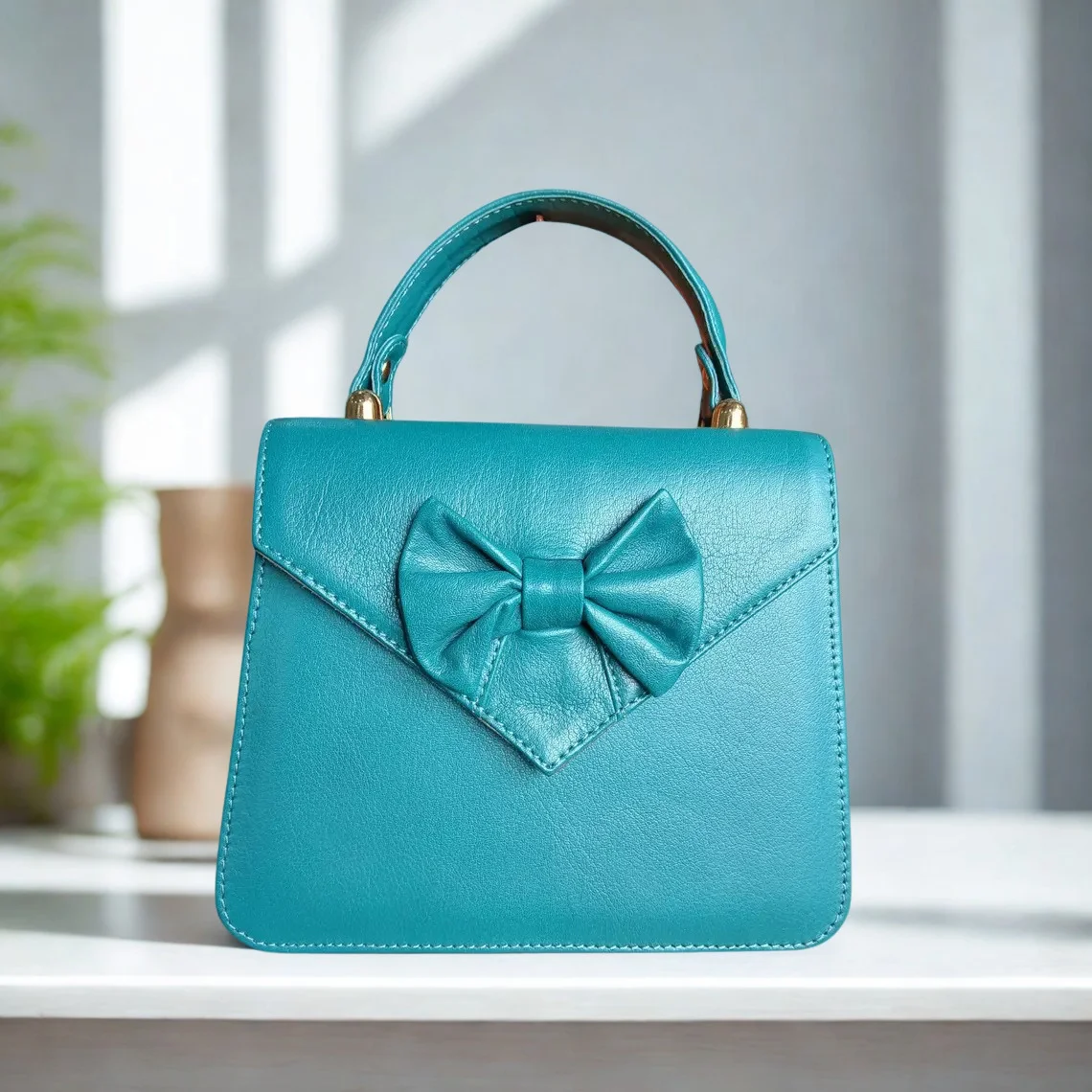Leather Hill Bow Satchel in aqua blue