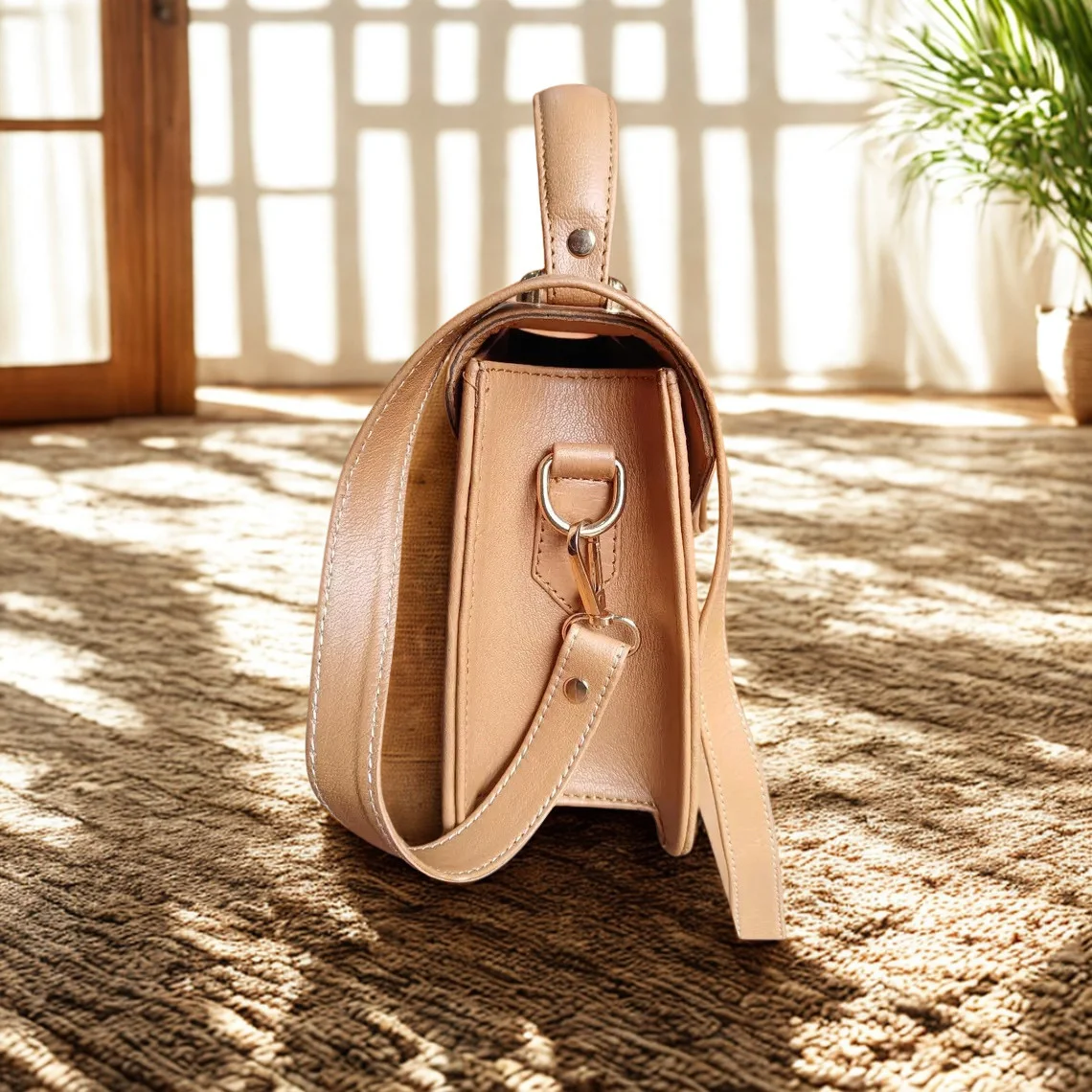 Leather Hill Bow Satchel side view in camel brown