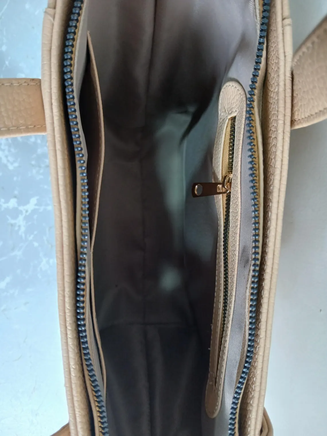 Spacious interior of Leather Hill beige leather tote bag
