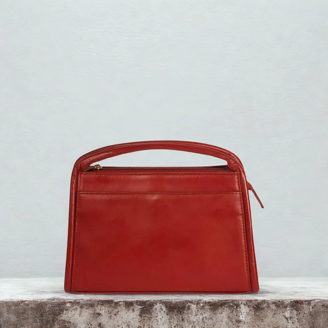 Leather Hill red top-handle bag back with strap attachment rings